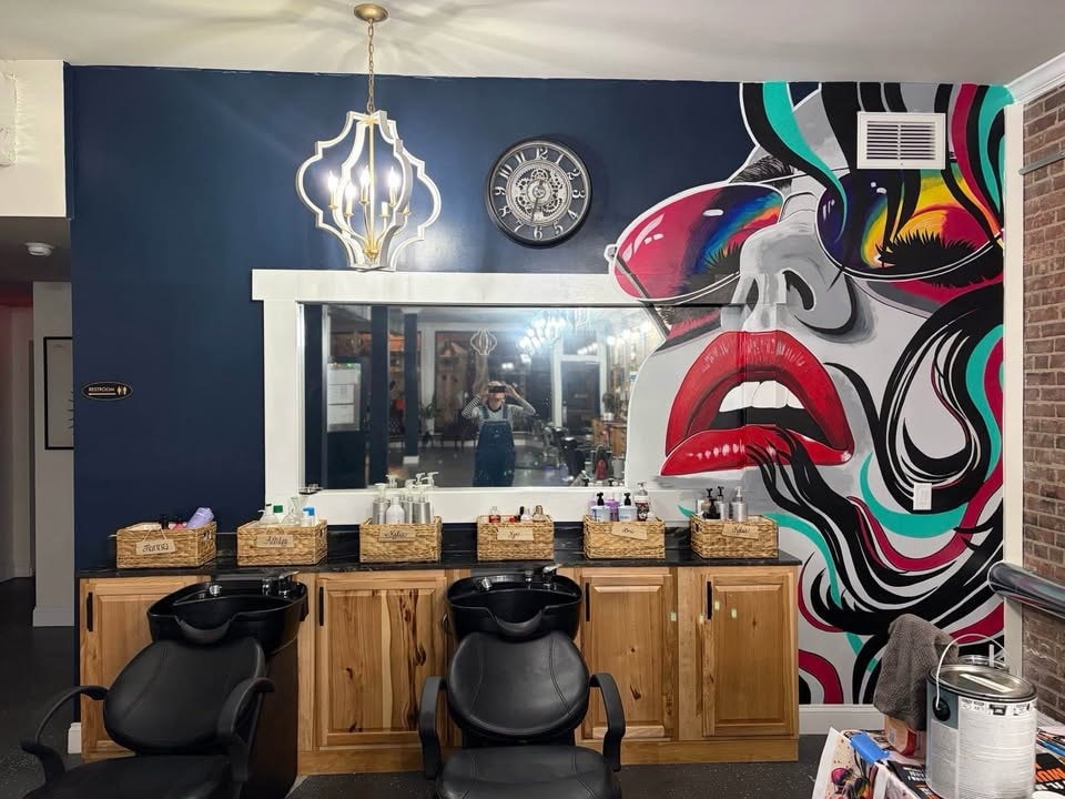 Beauty professional working in a salon suite at Beauty Beyond Borders